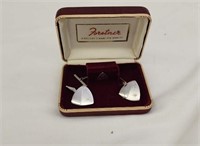 Cufflink and tie clip set.