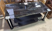 Glass top television stand. 20 inches high X 50 X