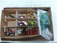 assortment of toy tractor parts