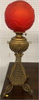 Red Satin Glass And Filigree Scroll Brass Lamp