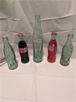 5 Coke Bottles