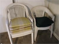 Four White Plastic Lawn Chairs