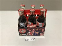 6 pack Coca-Cola bottles