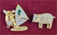 Rhinestone and goldtone pig brooches