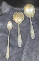 Silver plated serving spoons.