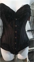 Black corset with lace trim. Size Large