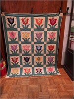 Vintage handstitched quilt, each block with