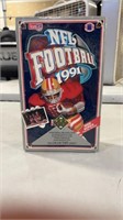 Lot of football cards factory sealed in box.