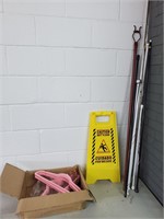 Pink velvet hangers wet floor sign and rods