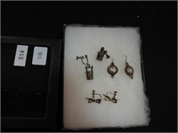Three pairs of earrings: one pair marked