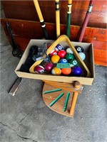 Pool cues, balls and stand