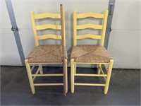 Pair of wood and wicker chairs.