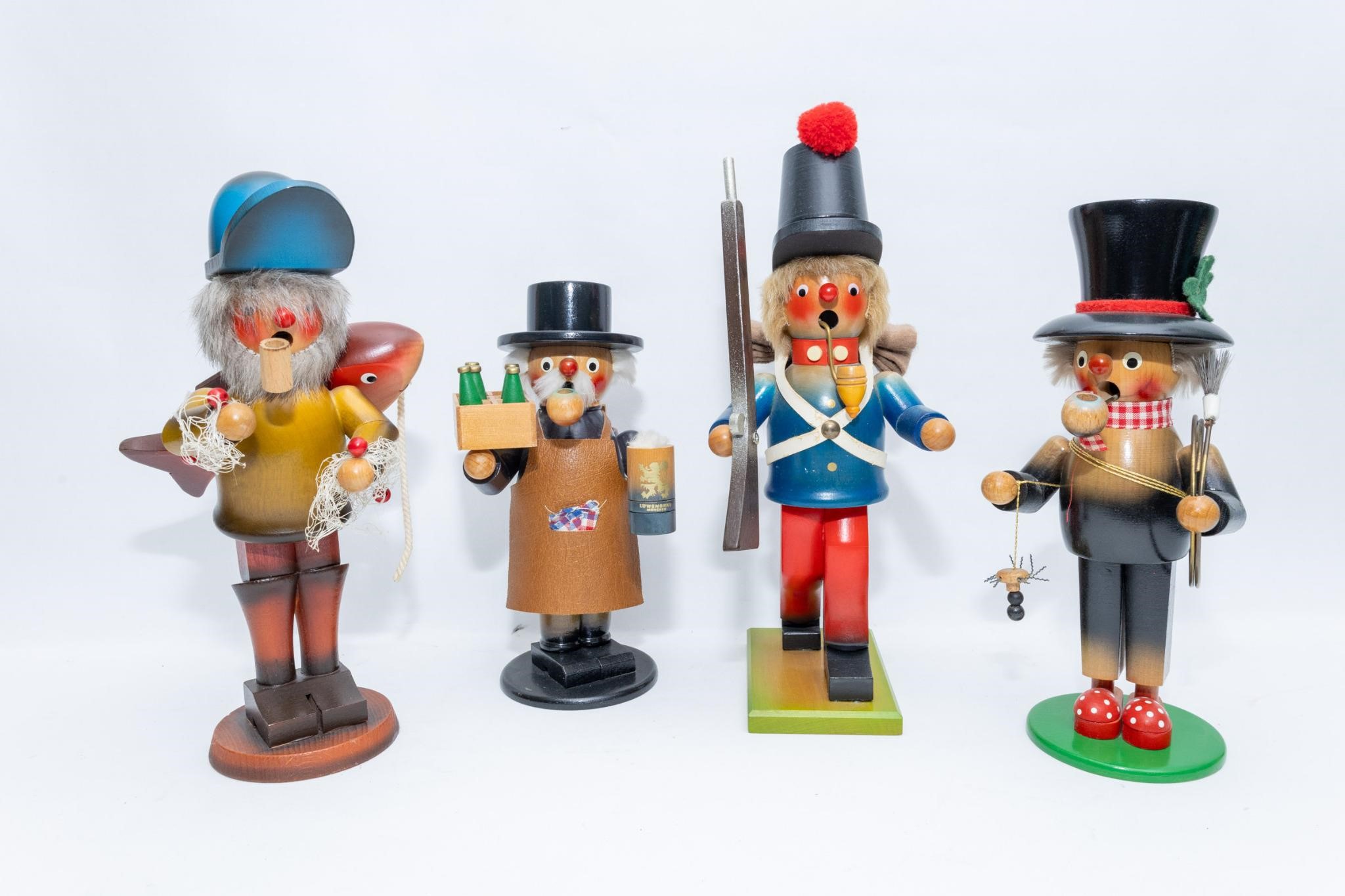 Four vintage nutcrackers including Steinbach