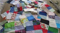 STACK OF QUILTED FABRIC QUILT SQUARES