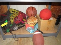 assorted sporting game equipment football basket