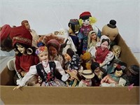 A box of several dolls, different types and