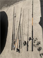 Assortment of 8 fishing poles, 2 with reels
