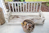 Wooden Porch Swing and a Basket Full of Leather