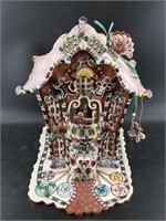 Gingerbread palace figurine with music box and car
