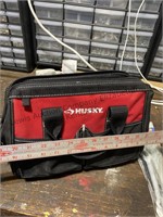 Husky canvas tool bag with a variety of tools