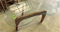 Kidney shape glass top coffee table 43”X26”
