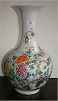 Large globular vase decorated with flowers &