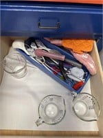 Drawer of measuring items and hot pads
