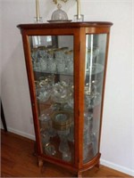 Curved glass cabinet w/ content gold rim ect.