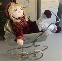Vintage baby buggy stroller and large doll