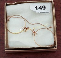 Gold wire frame glasses, missing one lens, 1909