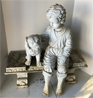 Boy on bench statue