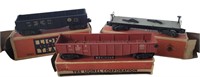 THREE EARLY LIONEL TRAIN CARS IN ORIGINAL BOXES