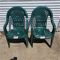 2 green plastic chairs