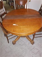 Lot #125 Antique Oak paw foot dining table