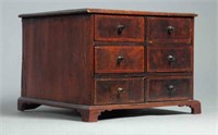 GEORGE III TABLE-TOP CASE OF DRAWERS