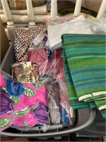 Tote of assorted material and a tote of fabric