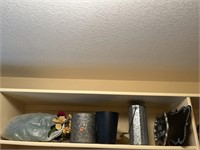 top metal shelf of decorative and craft items