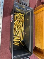 Ammo box and 48 loose rounds of 243