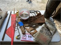 Welding torch, gloves, sandbags, copper pipe,