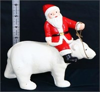 Cast iron Santa on polar bear bank