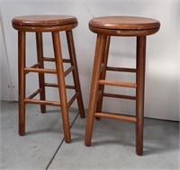 Two wood swivel seat stools 25.5 inches from seat