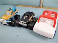 Toys including monster truck and tow truck