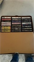 Assorted cassette tapes in carrying case