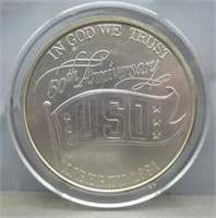 1991 USO 50th anniversary silver dollar.