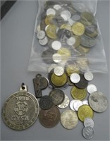 Assortment of foreign coins and tokens.