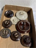 Assorted stoneware jar lids/covers