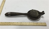 Cast iron citrus juicer -no visible marking