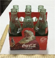 6 glass Coca-cola bottles w/ cardboard carrier