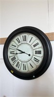 Oversize wall clock approximately 30 inches wide,