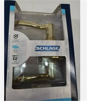 Schlage Bright Brass Flair Lever Privacy Set